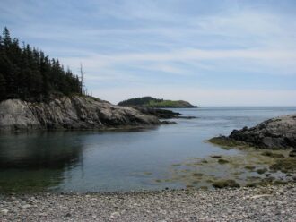 pebble beach, water, island in distance