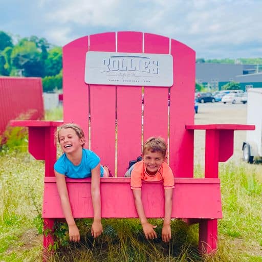 big red chair with two kids