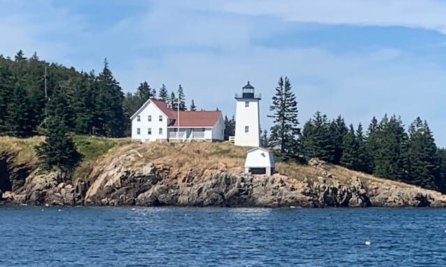 Burnt Coat Harbor lighthouse on rocky shore