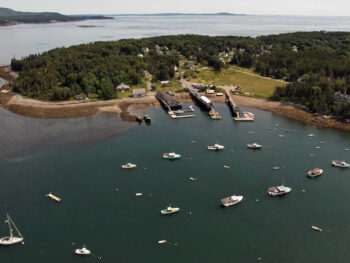 Aerial view of the Islesford docks with boats moored in the harbor.