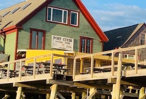 Port Clyde general store with dock pilings in foreground