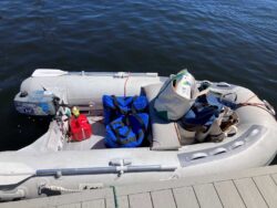 grocery totes loaded into dinghy at dock